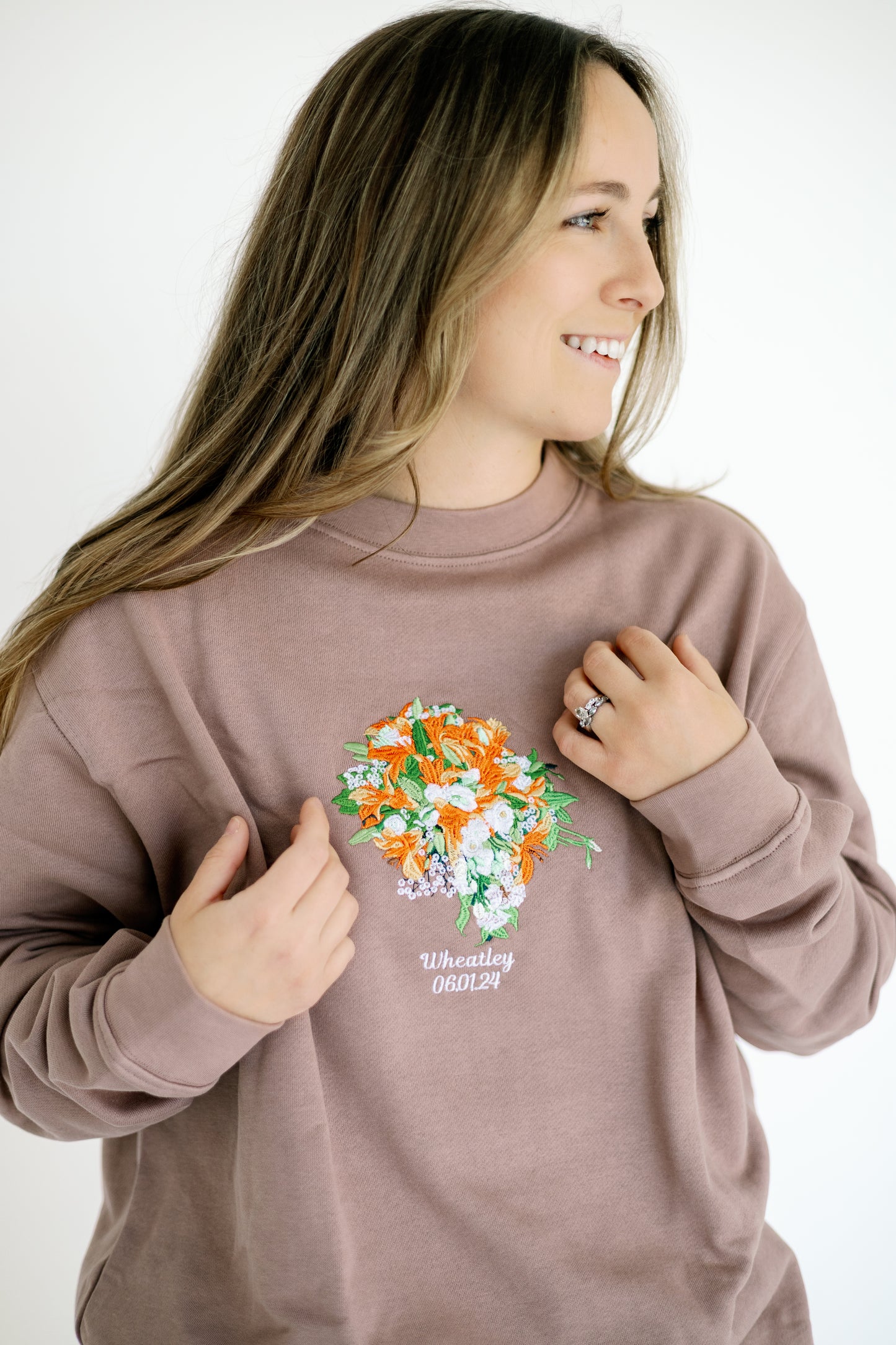 Custom embroidered wedding bouquet on clay crewneck sweatshirt with name and date